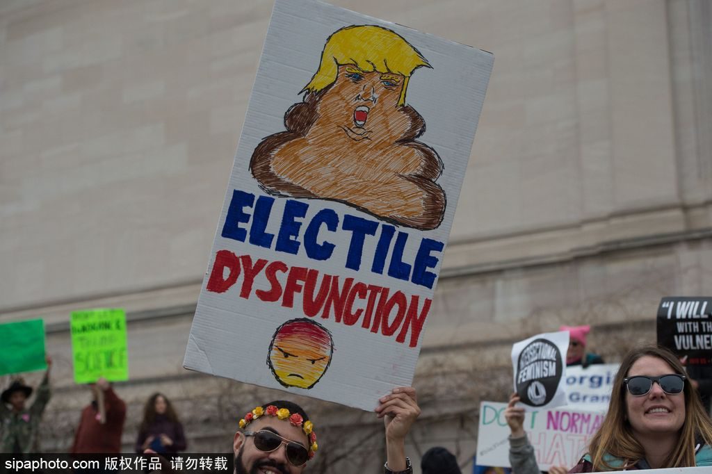 Mandatory Credit: Photo by John Middlebrook/CSM/REX/Shutterstock (7945857cq) A marcher holds a sign during the Women's March on Washington the day after the inauguration of Donald Trump in Washington, DC NEWS Women's March on Washington, Washington Dc, USA - 21 Jan 2017