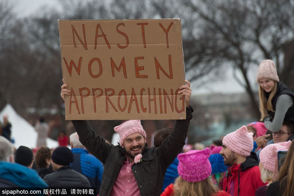 Mandatory Credit: Photo by John Middlebrook/CSM/REX/Shutterstock (7945857ck) A marcher holds a sign during the Women's March on Washington the day after the inauguration of Donald Trump in Washington, DC NEWS Women's March on Washington, Washington Dc, USA - 21 Jan 2017