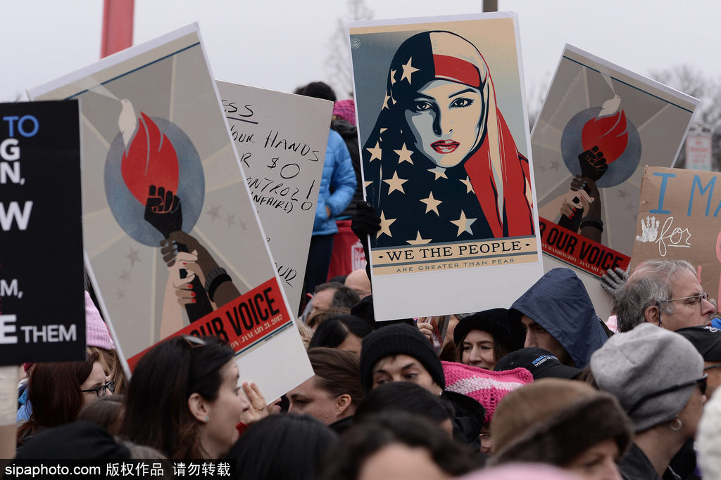 People participate in the Womens March on Washington held at the National Mall in Downtown Washington D.C. on January 21, 2017. The march takes place a day after the Presidential Inauguration Ceremony for President Donald Trump and is intended to unify protesters who oppose Trumps politics. (Photo by Anthony Behar) *** Please Use Credit from Credit Field ***
